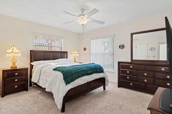 a bedroom with a bed and a dresser