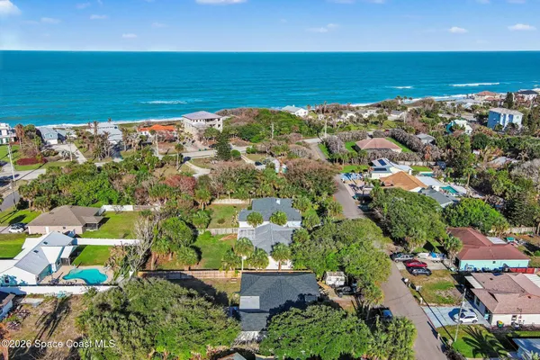 an aerial view of a houses with a lake view