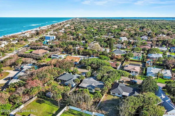 an aerial view of residential houses with outdoor space