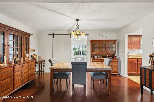 a dining room with furniture window wooden floor