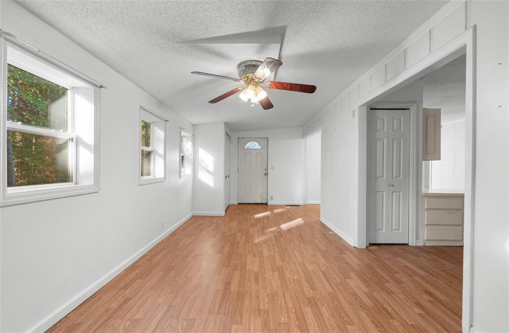 620 Wash Wilson Road Blue Ridge, GA 30513 - Photo 16 of 26 a view of empty room with wooden floor and fan