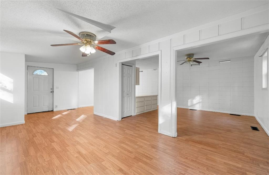 620 Wash Wilson Road Blue Ridge, GA 30513 - Photo 17 of 26 a view of empty room with wooden floor and ceiling fan