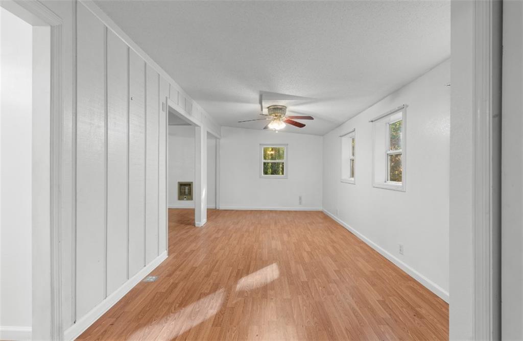620 Wash Wilson Road Blue Ridge, GA 30513 - Photo 21 of 26 a view of an empty room with wooden floor