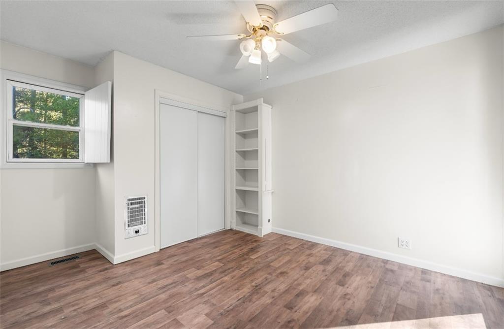 620 Wash Wilson Road Blue Ridge, GA 30513 - Photo 23 of 26 wooden floor in an empty room with a window