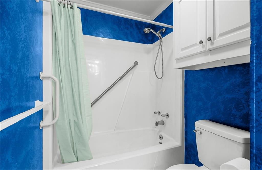 620 Wash Wilson Road Blue Ridge, GA 30513 - Photo 26 of 26 a bathroom with a shower a toilet and a sink