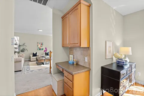 a kitchen with a sink cabinets and a table