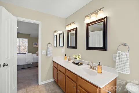 a bathroom with a sink vanity and mirror