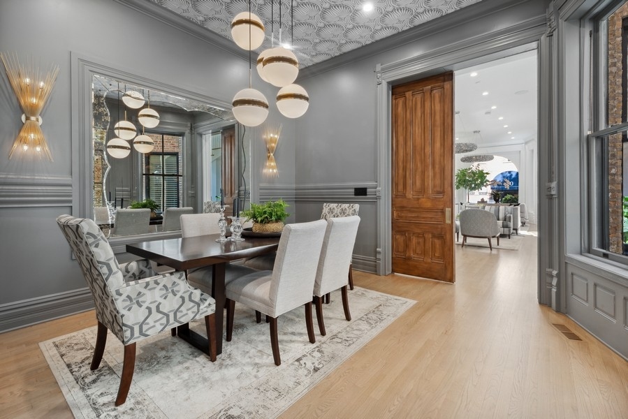 19 East Goethe Street Chicago, IL 60610 - Photo 12 of 46 a view of a dining room with furniture and a large window
