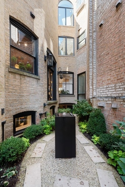 19 East Goethe Street Chicago, IL 60610 - Photo 20 of 46 a building with potted plants in front of it