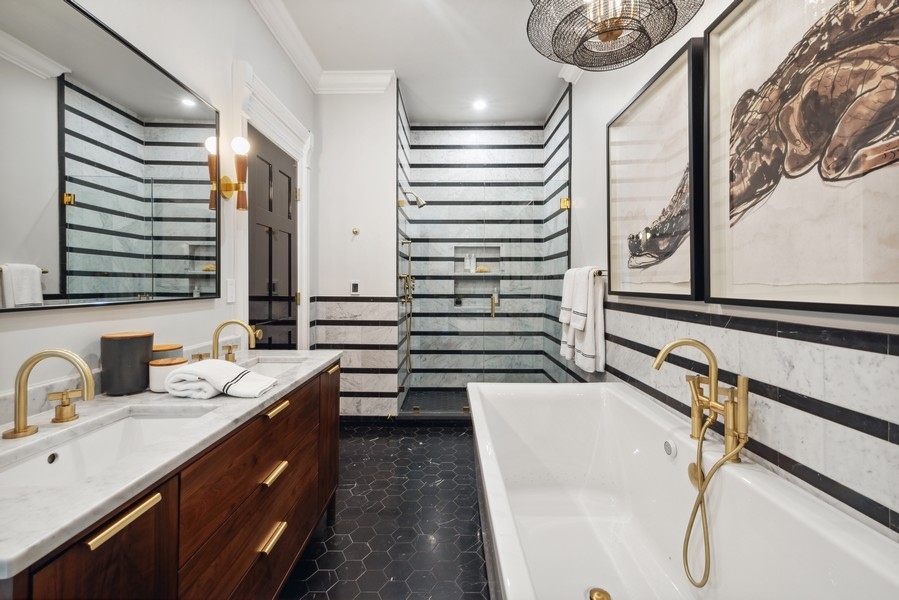 19 East Goethe Street Chicago, IL 60610 - Photo 41 of 46 a bathroom with a sink and a mirror