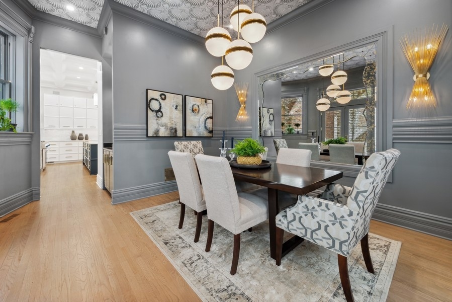 19 East Goethe Street Chicago, IL 60610 - Photo 9 of 46 a view of a dining room with furniture and wooden floor