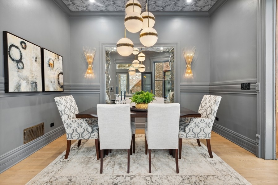 19 East Goethe Street Chicago, IL 60610 - Photo 10 of 46 a view of a dining room with furniture and a large window