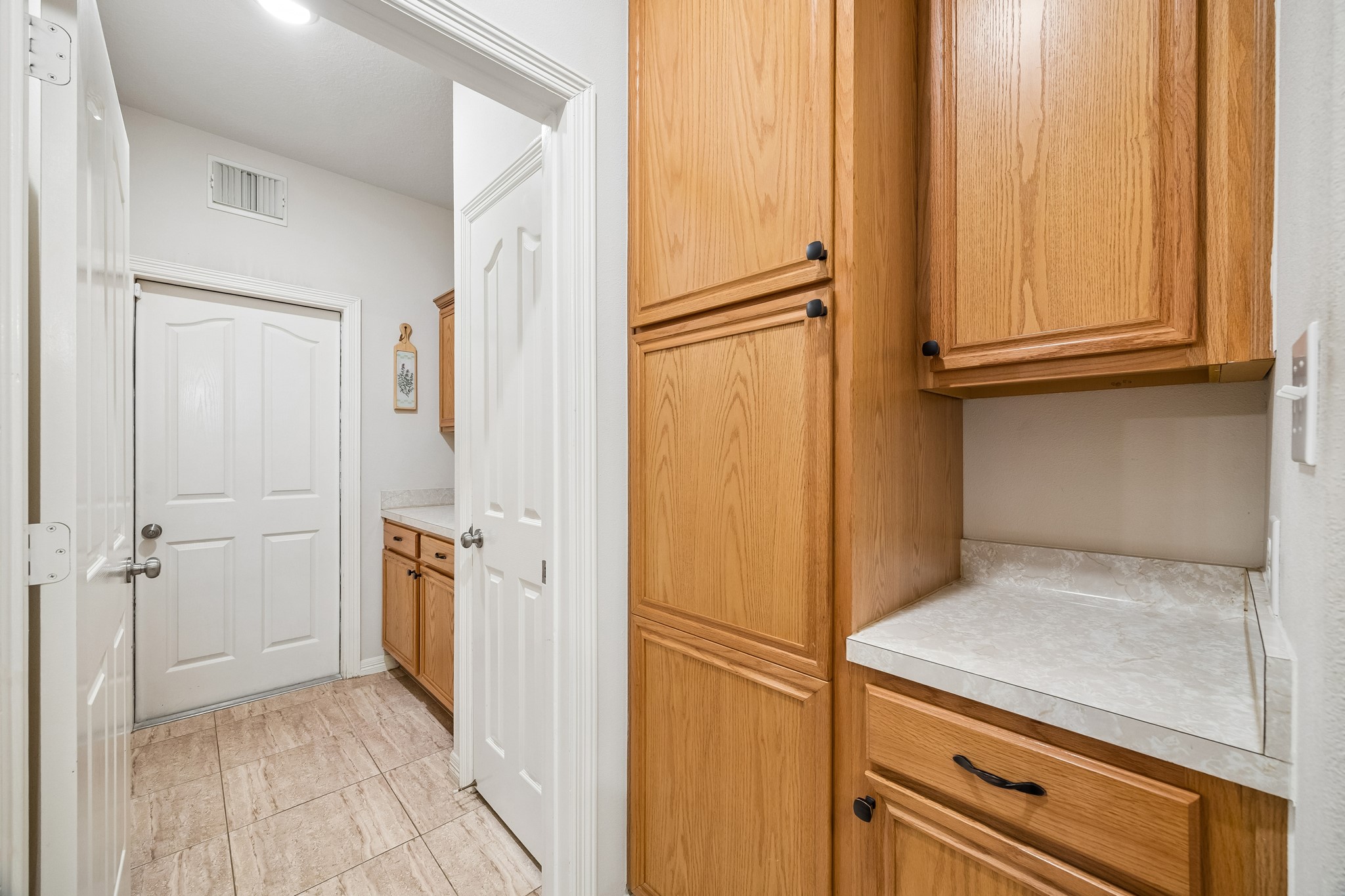 7618 North Linpar Court Houston, TX 77040 - Photo 10 of 34 The Pantry and Butler's Pantry provide provide immense storage and entertaining possibilities. Also, Easy access to and from the attached two car garage.