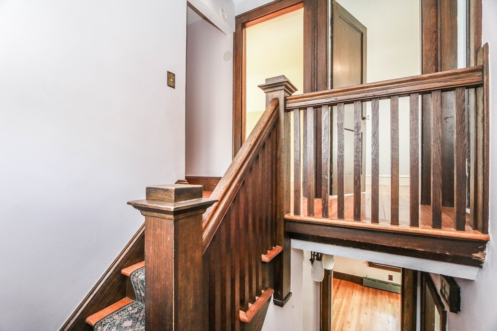 101 Manchester Terrace Springfield, MA 01108 - Photo 25 of 42 a view of staircase with railing and a window
