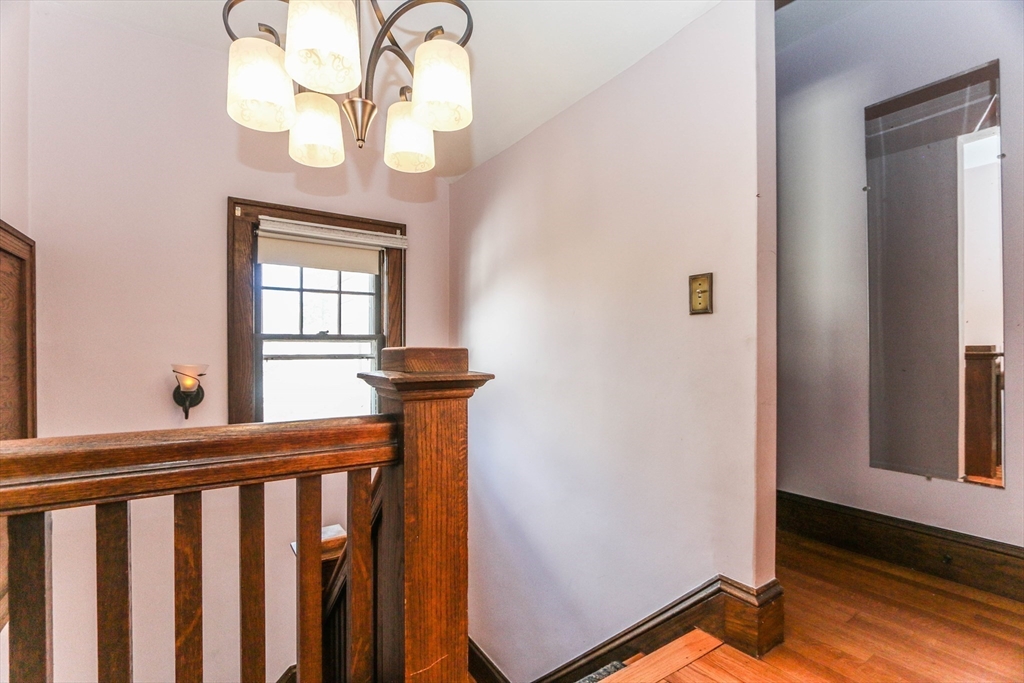 101 Manchester Terrace Springfield, MA 01108 - Photo 27 of 42 a view of a hallway with windows and chandelier