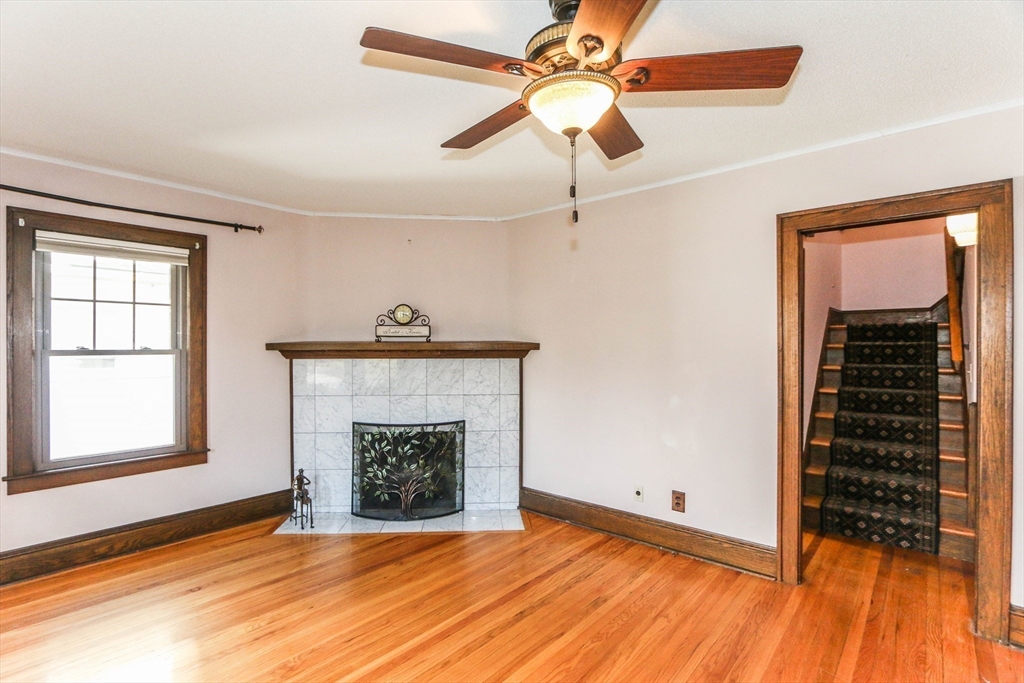 101 Manchester Terrace Springfield, MA 01108 - Photo 5 of 42 an empty room with windows and a fireplace