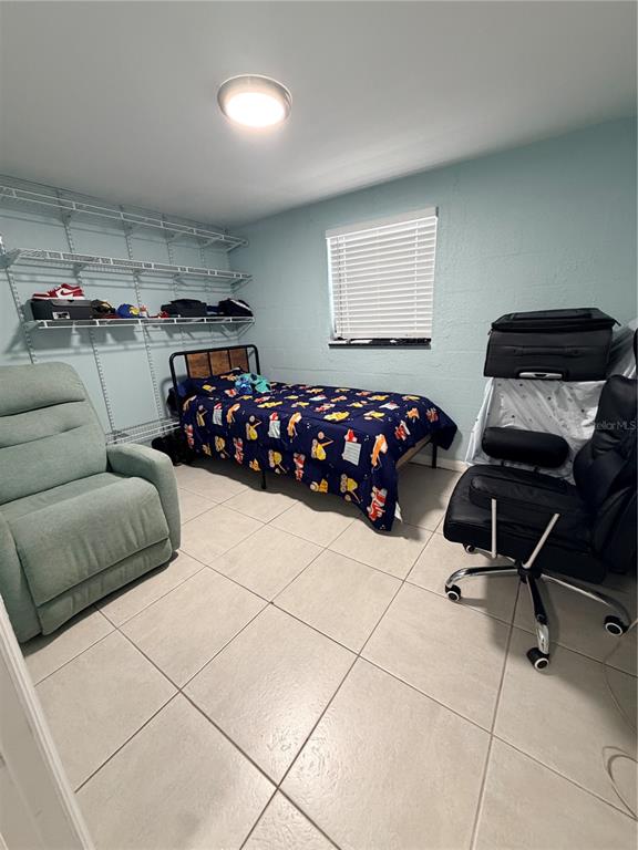 2216 Webber Street, Unit C Sarasota, FL 34239 - Photo 6 of 11 a bedroom with furniture and window