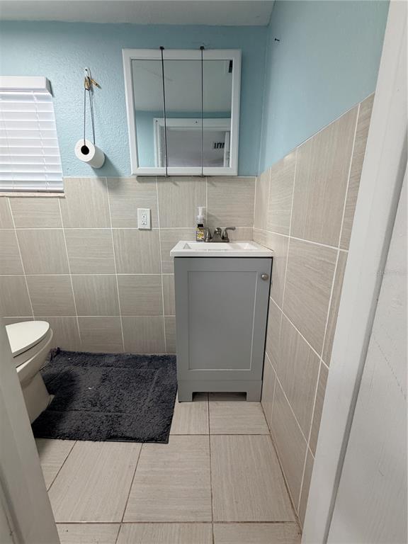 2216 Webber Street, Unit C Sarasota, FL 34239 - Photo 8 of 11 a bathroom with a sink a toilet and shower