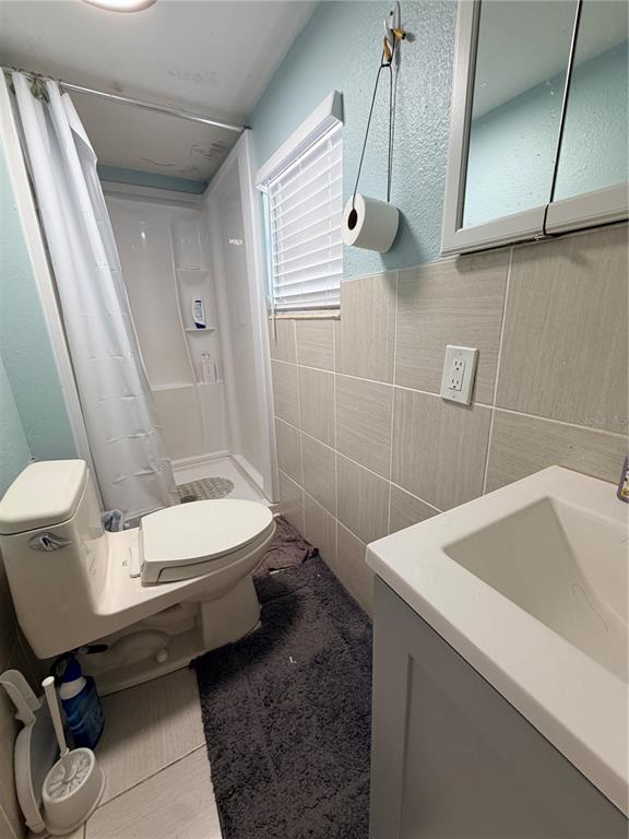 2216 Webber Street, Unit C Sarasota, FL 34239 - Photo 9 of 11 a bathroom with a sink a toilet and tub