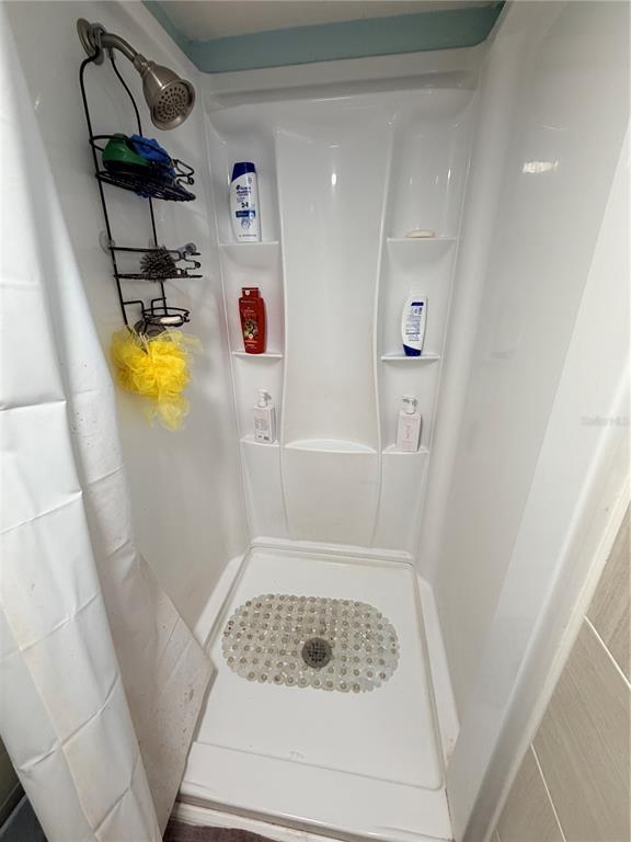 2216 Webber Street, Unit C Sarasota, FL 34239 - Photo 10 of 11 a bathroom with a tub
