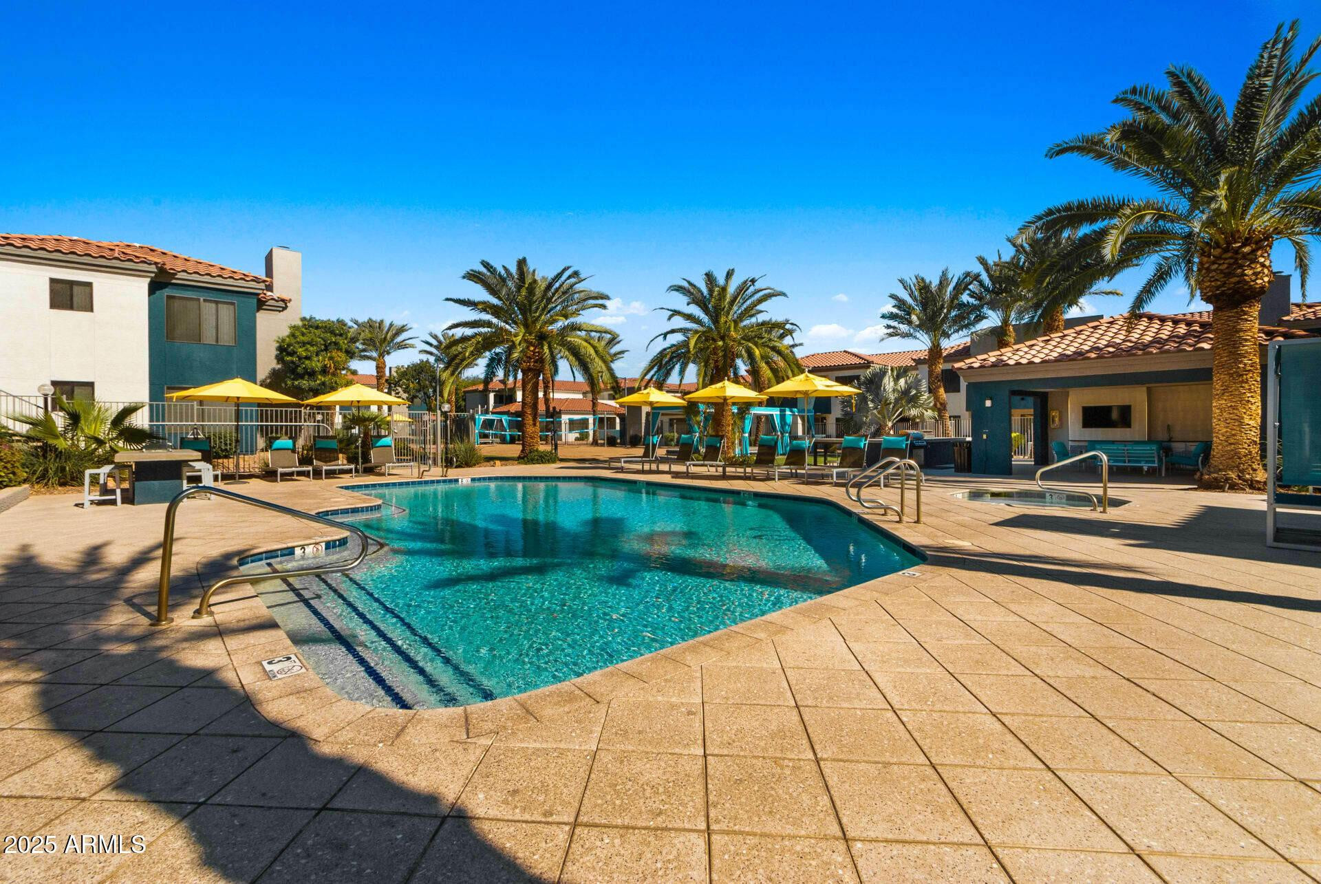 13625 South 48th Street, Unit 2 Phoenix, AZ 85044 - Photo 3 of 9 a view of outdoor space with swimming pool and patio