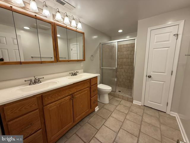 607 St Dunstans Road Baltimore, MD 21212 - Photo 19 of 25 a spacious bathroom with a double vanity sink mirror and toilet