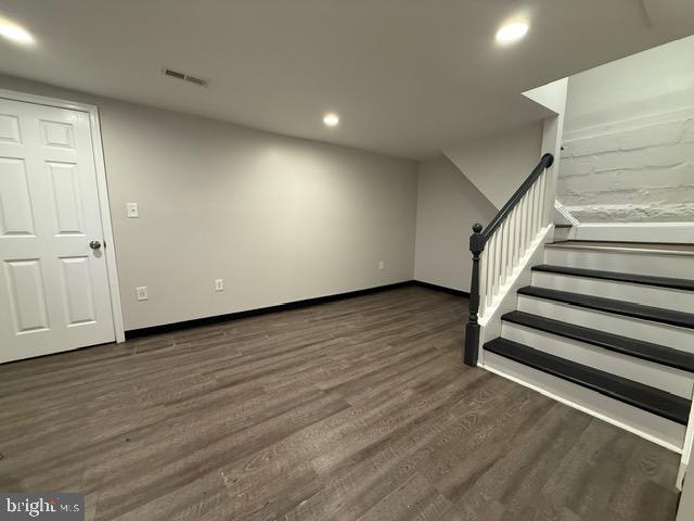 607 St Dunstans Road Baltimore, MD 21212 - Photo 20 of 25 an empty room with wooden floor and windows
