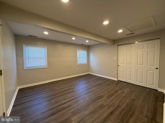 607 St Dunstans Road Baltimore, MD 21212 - Photo 21 of 25 a view of an empty room with wooden floor and a window
