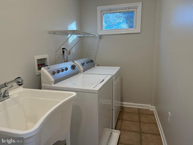 607 St Dunstans Road Baltimore, MD 21212 - Photo 23 of 25 a utility room with dryer and washer