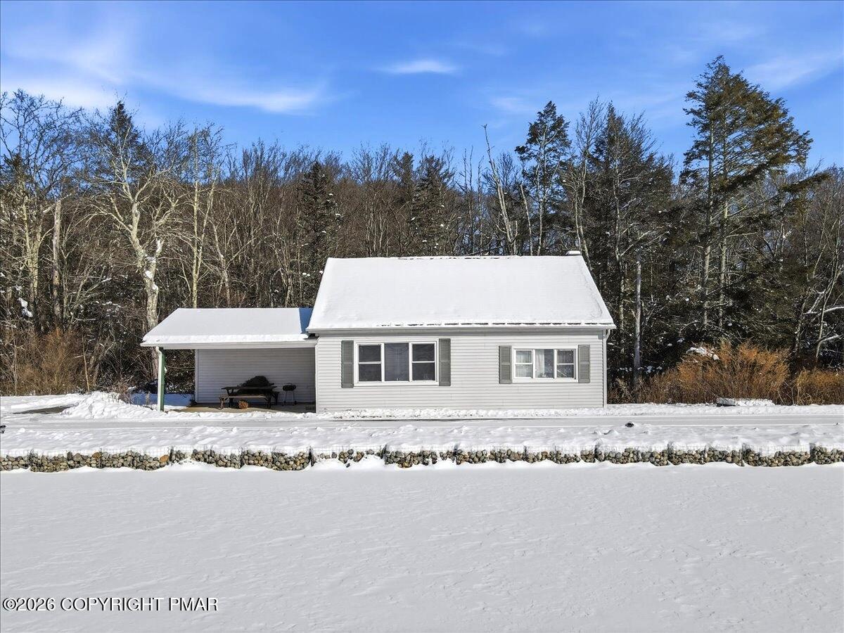 306 Merwinsburg Road Effort, PA 18330 - Photo 12 of 87 a view of a white house with a yard and large trees