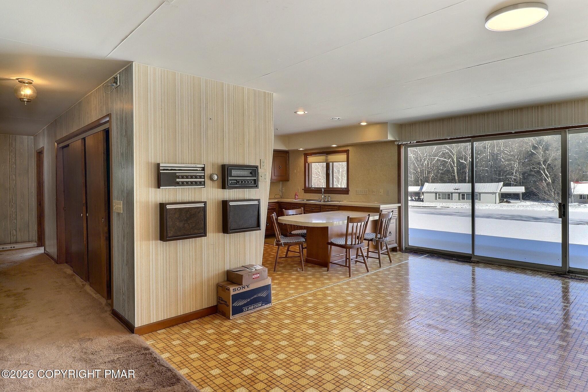 306 Merwinsburg Road Effort, PA 18330 - Photo 38 of 87 a kitchen with stainless steel appliances granite countertop a stove top oven a sink and a refrigerator