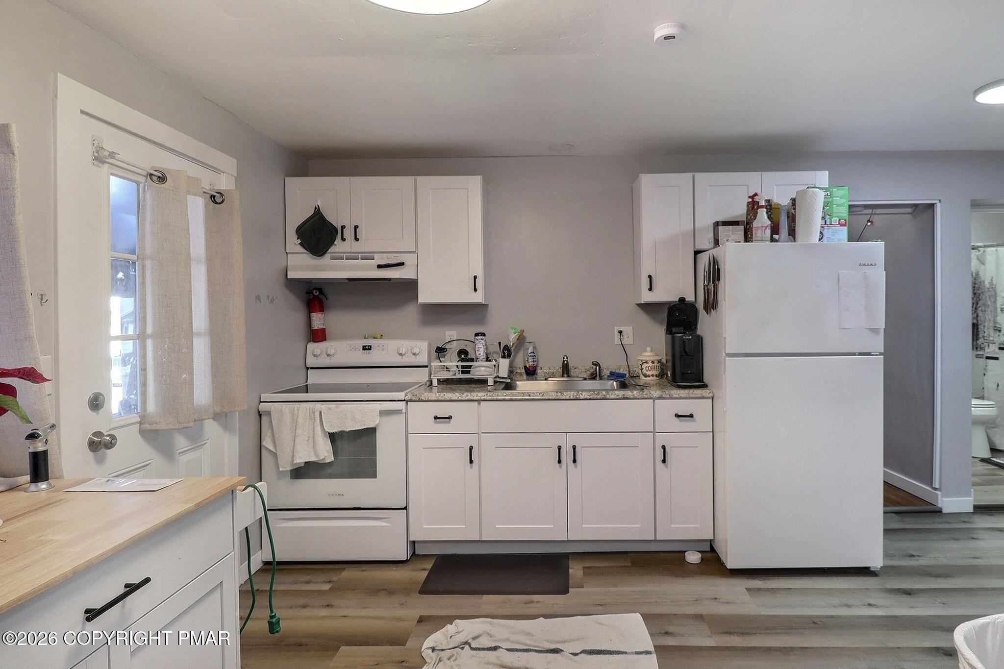 306 Merwinsburg Road Effort, PA 18330 - Photo 51 of 87 a kitchen with granite countertop a sink cabinets and stainless steel appliances
