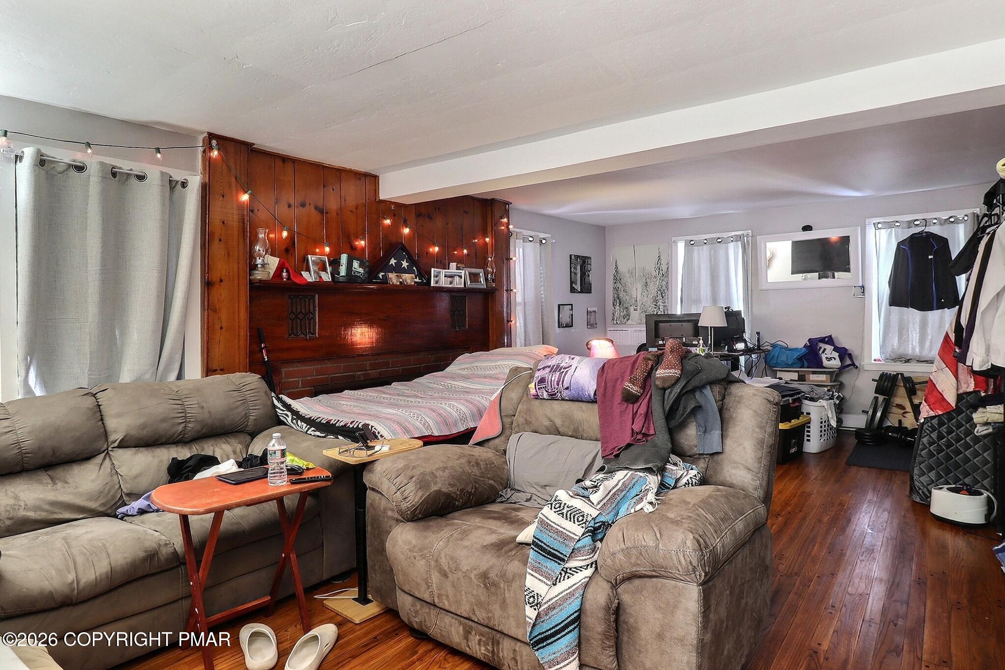 306 Merwinsburg Road Effort, PA 18330 - Photo 53 of 87 a living room with furniture a flat screen tv and a window