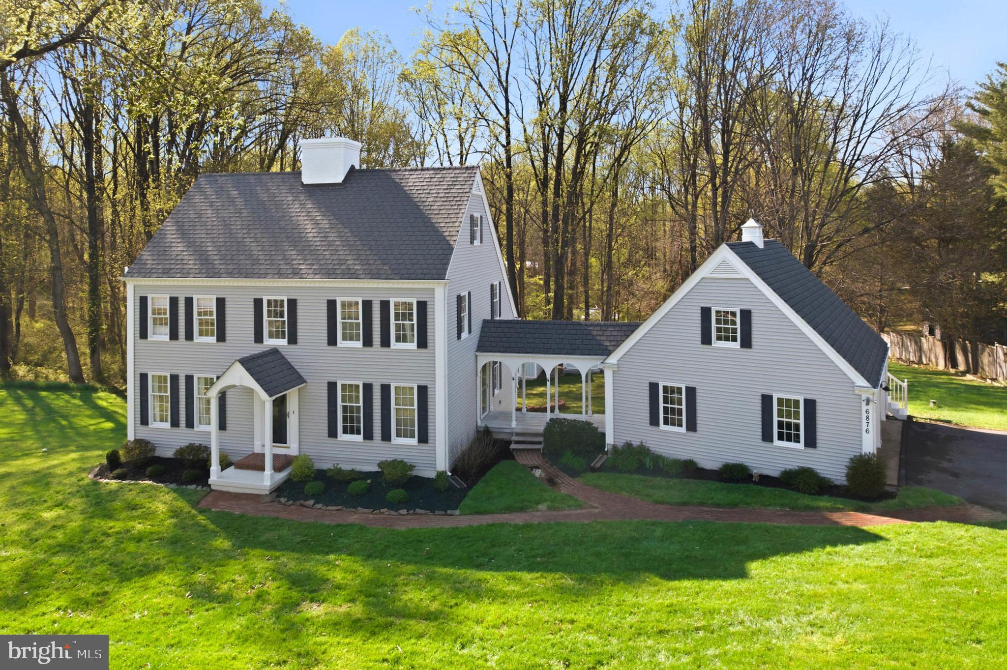 6876 Mink Hollow Road Highland, MD 20777 - Photo 2 of 61 a front view of a house with a garden and yard