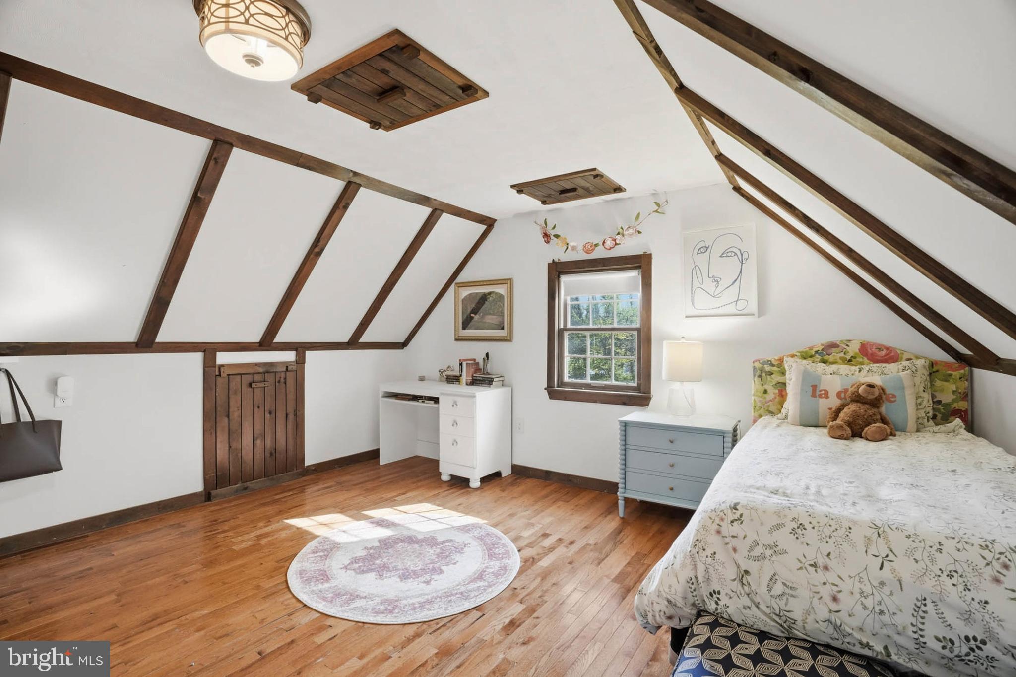 6876 Mink Hollow Road Highland, MD 20777 - Photo 33 of 61 a bedroom with a bed and wooden floor