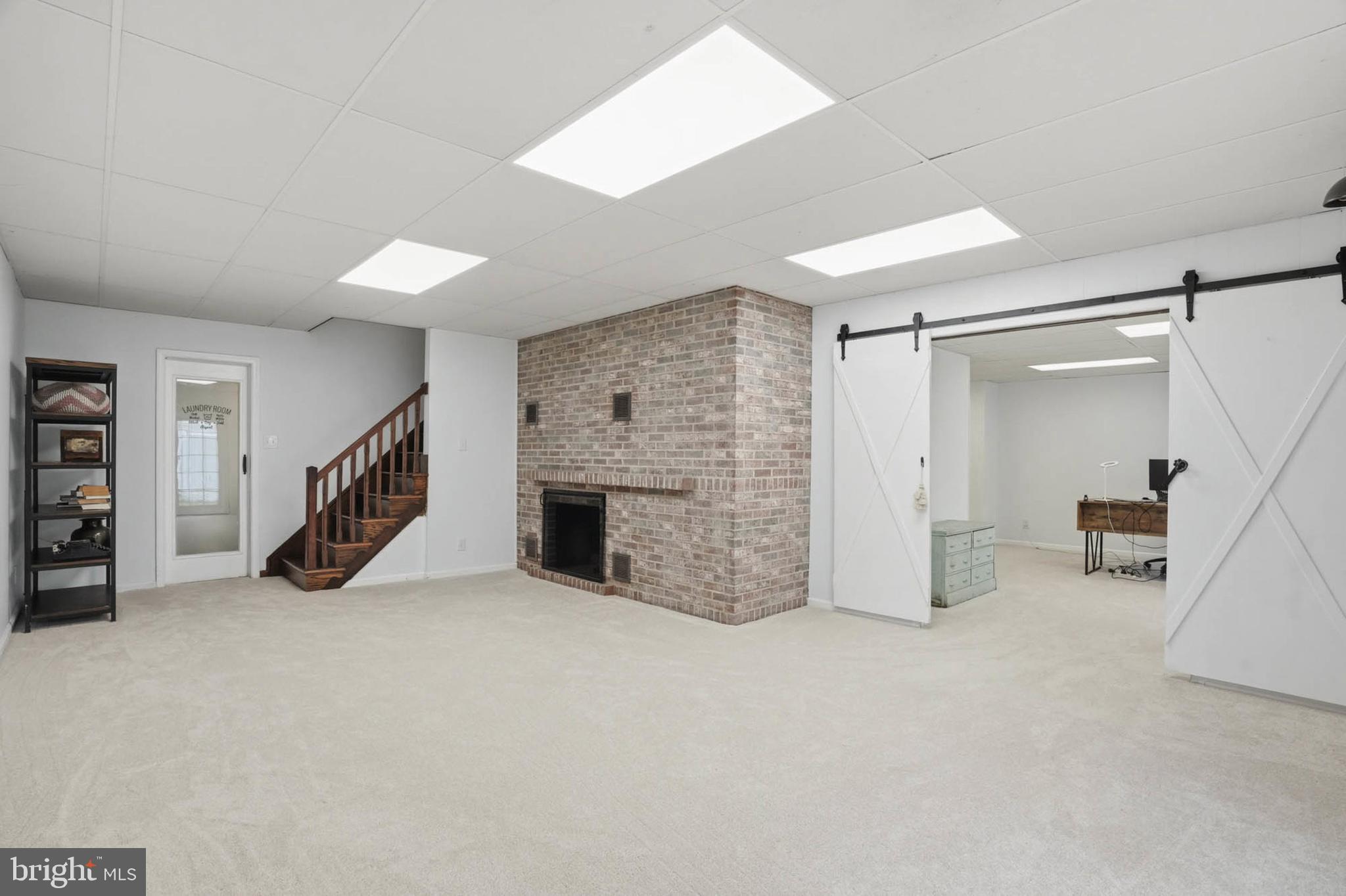 6876 Mink Hollow Road Highland, MD 20777 - Photo 37 of 61 a view of an empty room with furniture and a ceiling fan