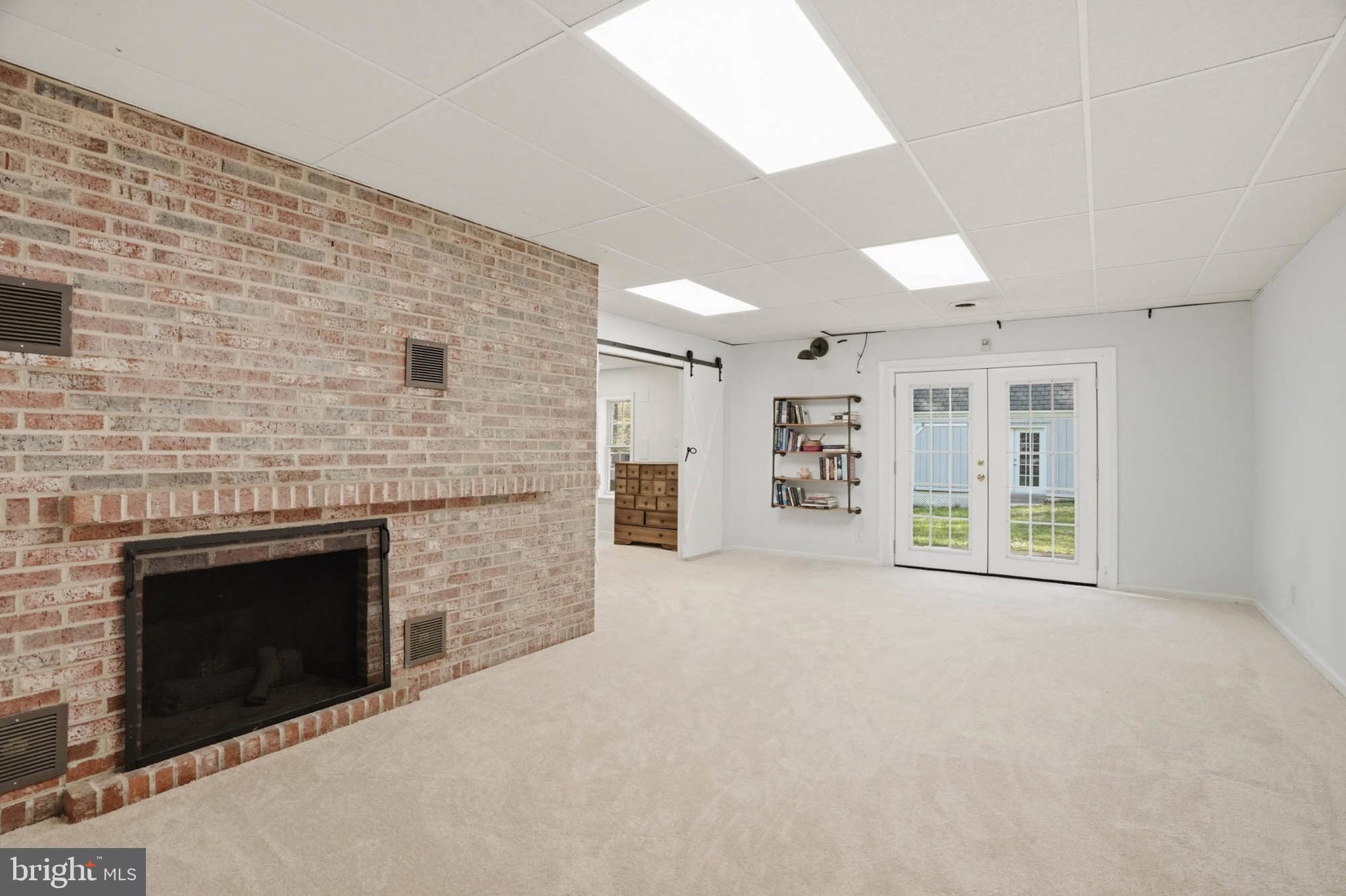 6876 Mink Hollow Road Highland, MD 20777 - Photo 38 of 61 a view of an empty room with a fireplace