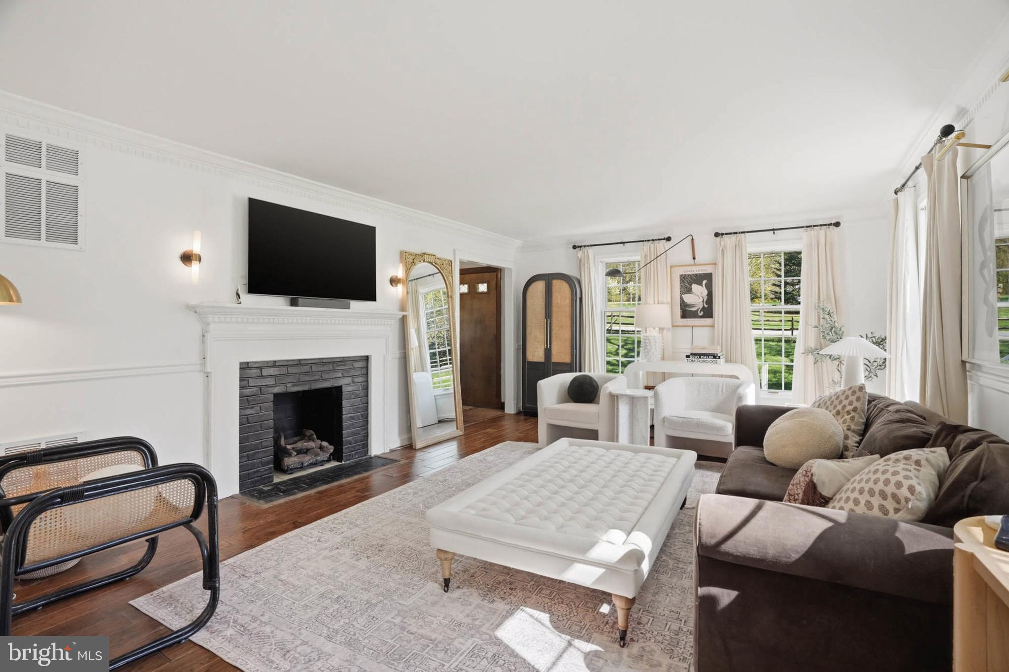6876 Mink Hollow Road Highland, MD 20777 - Photo 6 of 61 a living room with furniture a flat screen tv and a fireplace