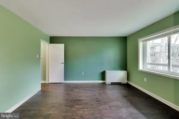 a view of room with window and workspace
