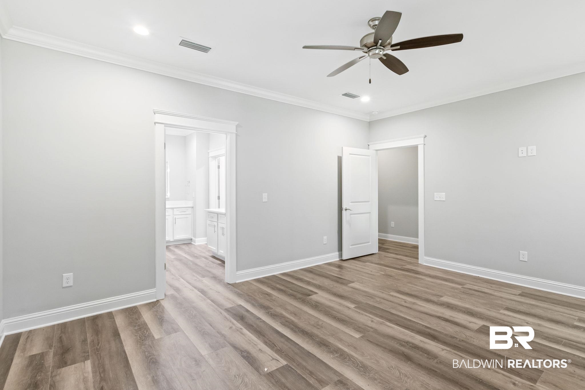 12441 Reunion Place Foley, AL 36535 - Photo 14 of 31 Spare room with ceiling fan, wood-type flooring, and ornamental molding