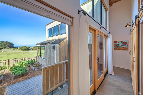 a view of a porch with wooden floor and outdoor space