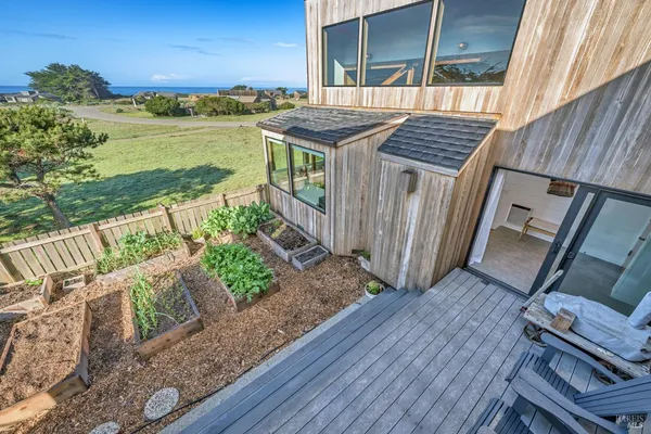 a view of a balcony with wooden floor