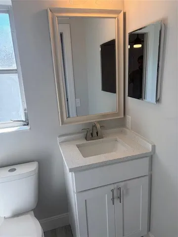 a bathroom with a sink and a toilet