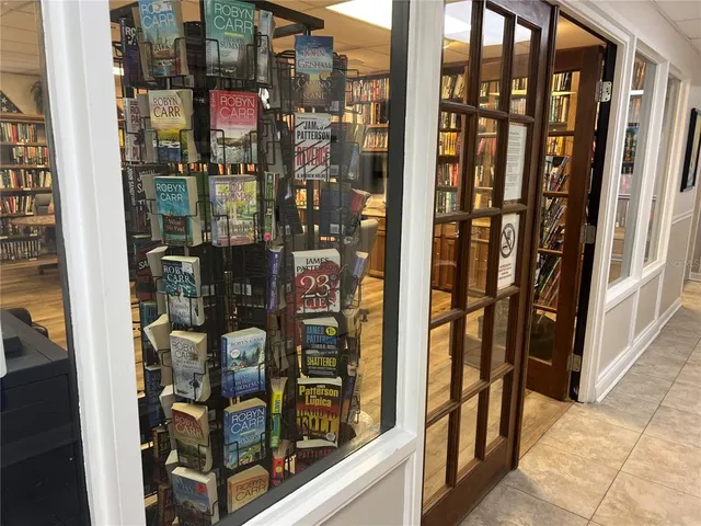 a view of a swimming pool with a table and chairs
