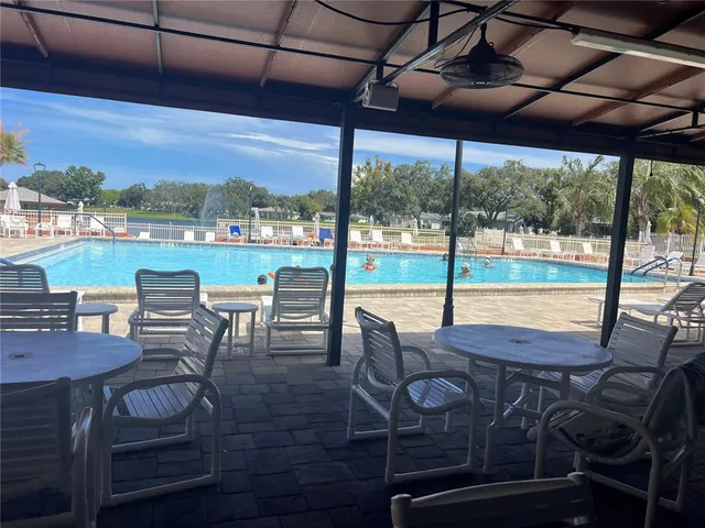 a view of a room with lots of wooden furniture