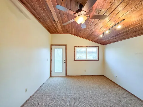a view of a house with wooden deck