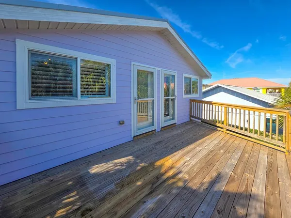 a view of balcony with wooden floor