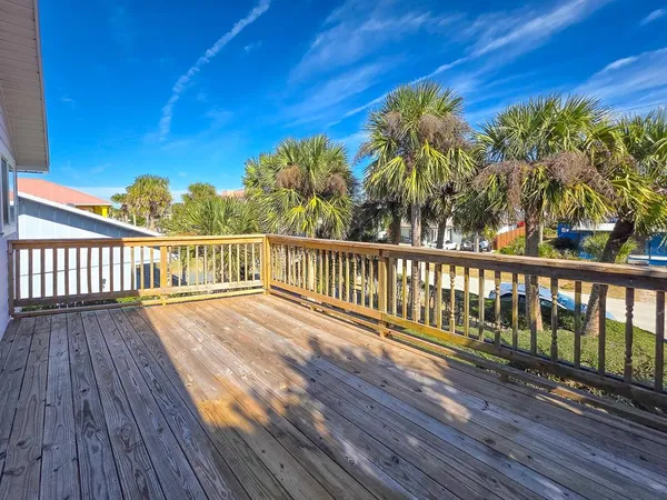 a view of balcony with wooden floor and outdoor space