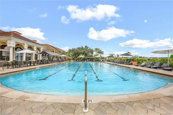 a view of a swimming pool with a yard