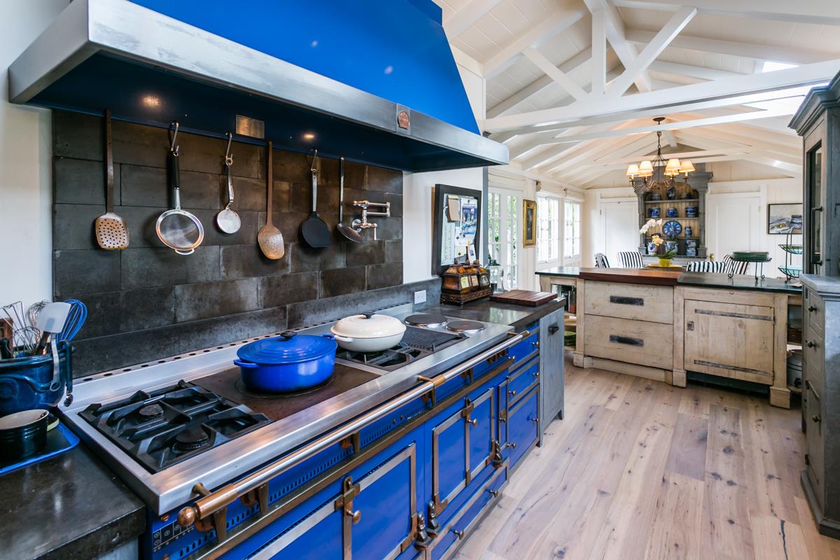 0 Camino Real Carmel, CA 93921 - Photo 14 of 27 a kitchen with stainless steel appliances granite countertop a stove a sink dishwasher and cabinets with wooden floor